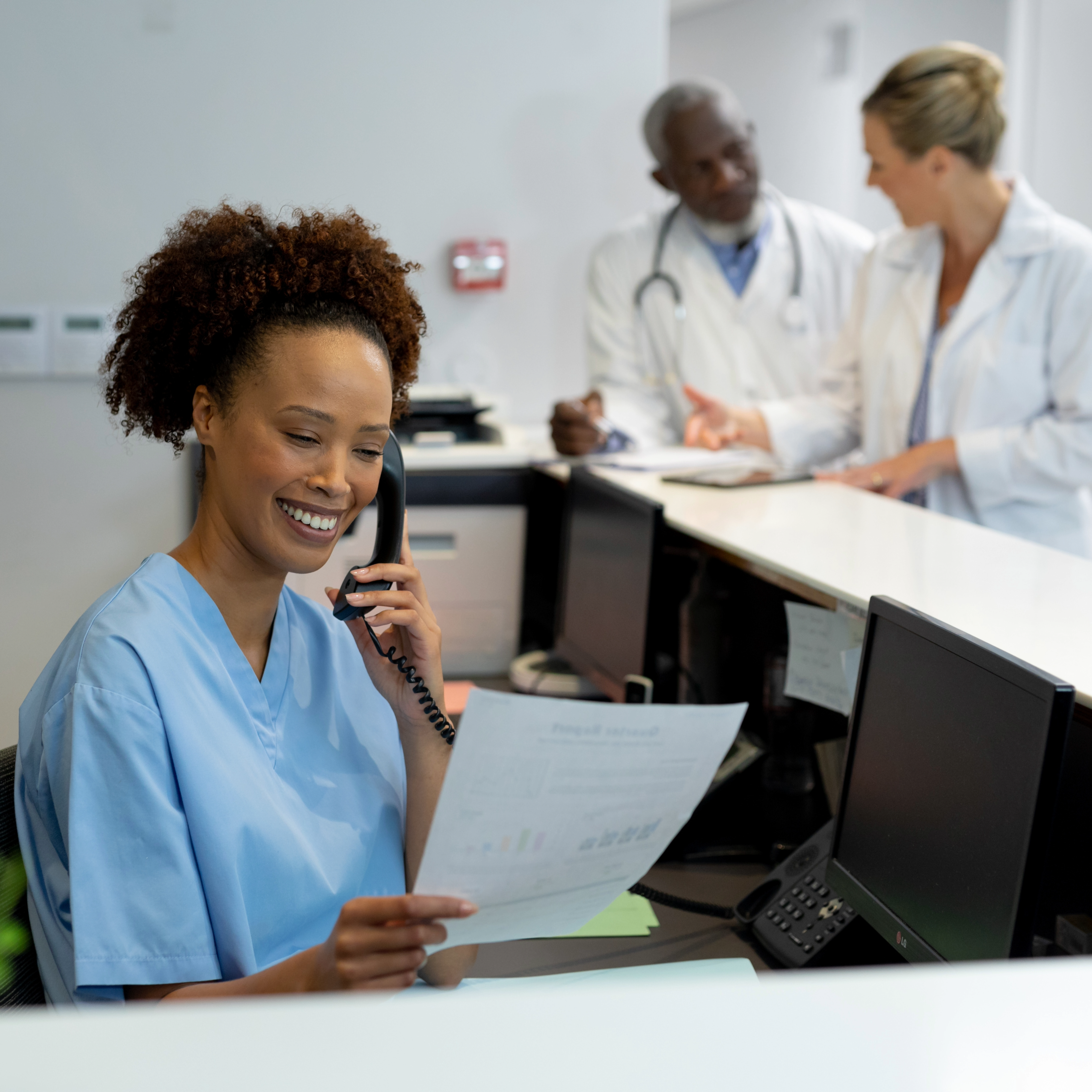 Professional woman working on laptop in modern office environment